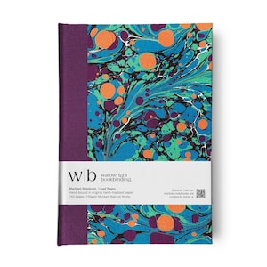 May include: A hardback notebook with a marbled cover in shades of blue, green, and orange. The spine is a deep purple. A white band across the bottom features the text "wb wainwright bookbinding."