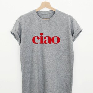 May include: A gray t-shirt with the word "ciao" printed in red on the front.