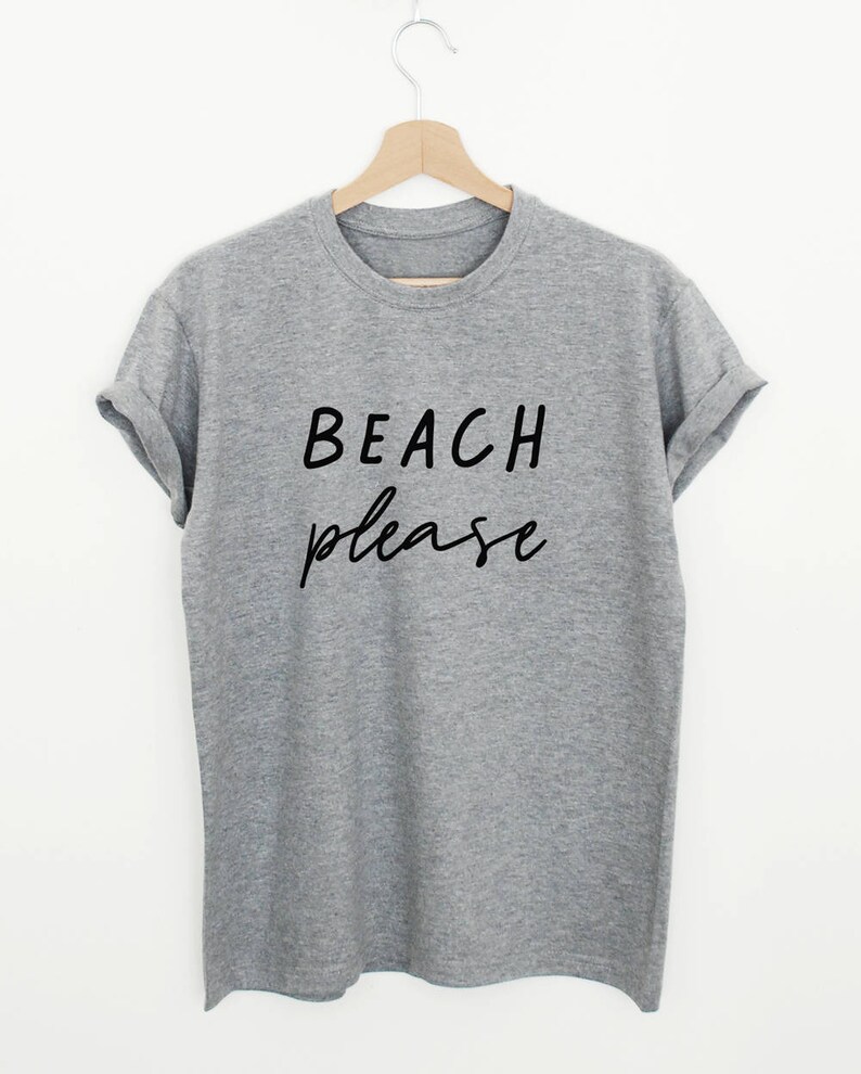 May include: A gray t-shirt with the text "BEACH please" printed in black.