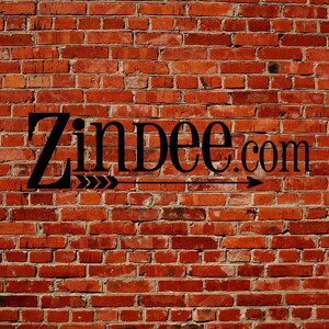 May include: A brick wall with the text "Zindee.com" in black lettering with a black arrow pointing to the right.