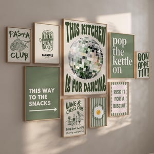 May include: A gallery wall set of nine framed prints featuring green and cream colour palettes. The posters display various kitchen-themed illustrations and text including Pasta Club, Sardines, This Kitchen Is For Dancing, Pop The Kettle On, Bon Appetit, This Way To The Snacks, Wine & Cheese Club, and Risk It For A Biscuit.
