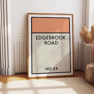 May include: A framed print with a peach colored rectangle at the top and a white rectangle at the bottom. The text "EDGEBROOK ROAD NO. 54" is printed in black on the white rectangle.