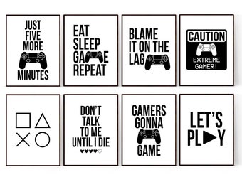 May include: Eight black and white printable wall art prints with gamer-themed text and graphics. The prints include phrases like "Just Five More Minutes", "Eat Sleep Game Repeat", "Blame It On The Lag", "Don't Talk To Me Until I Die", "Gamers Gonna Game", and "Let's Play".
