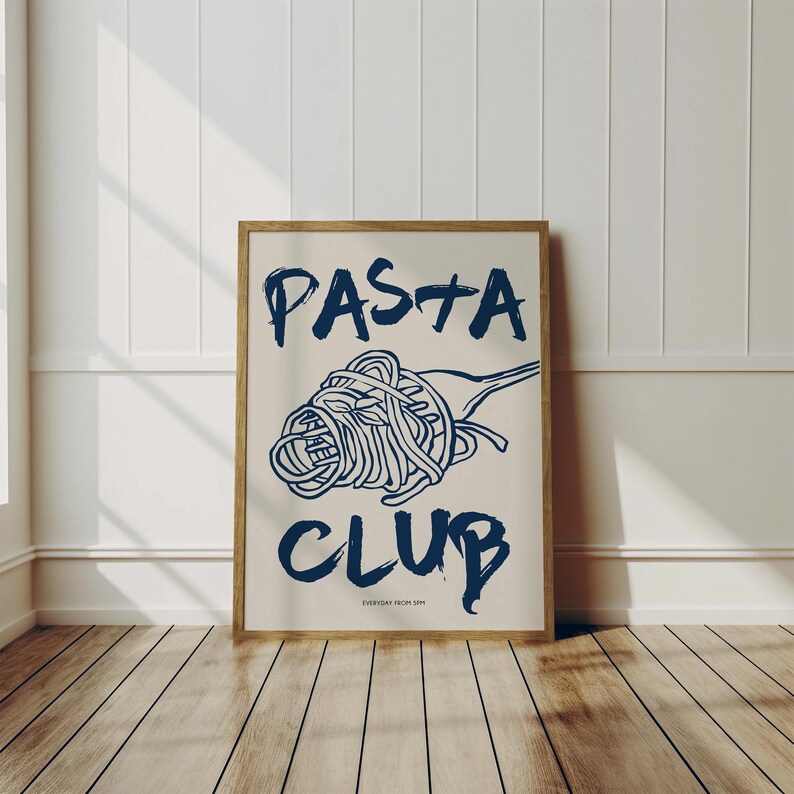 May include: A framed print with a blue illustration of a fork with spaghetti on it. The text "PASTA CLUB" is written in blue with the words "EVERYDAY FROM 5PM" in smaller font below.