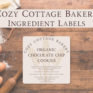 May include: A square sticker label for Cozy Cottage Bakery Organic Chocolate Chip Cookies. The label features wheat stalks, ingredient list, net weight of 8 oz / 250g, and baked on date of June 21, 2026. The text reads Cozy Cottage Bakery Ingredient Labels.