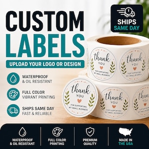 May include: A roll of circular white adhesive labels featuring the black text thank you for supporting my small business, green leaf illustrations, and a small pink heart. The labels are waterproof, oil resistant, and feature full color printing.