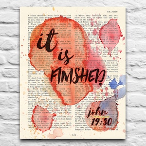 May include: A watercolor painting of a Bible verse from the book of John, chapter 19, verse 30. The verse reads "It is finished." The text is overlaid on a vintage book page with red and blue watercolor splatters.