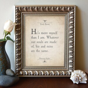 May include: A framed print with a quote from Emily Bront&euml;'s *Wuthering Heights*: "He's more myself than I am. Whatever our souls are made of, his and mine are the same."