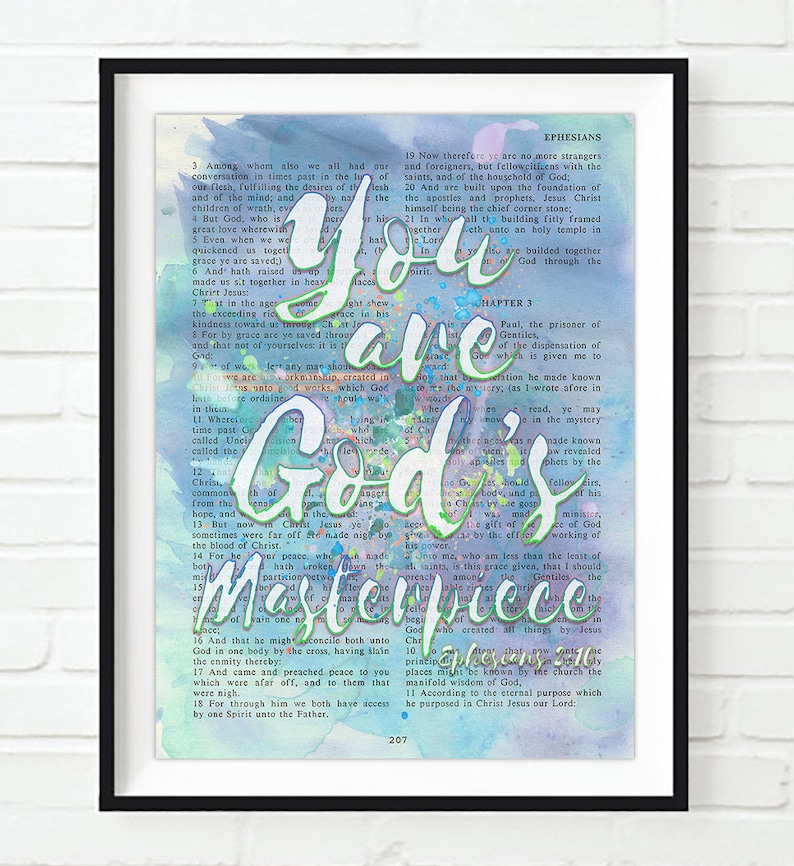May include: A watercolor print with a light blue, pink, and green background. The print features a bible verse from Ephesians 3:19-21, with the words "You are God's Masterpiece" highlighted in bold, colorful lettering.