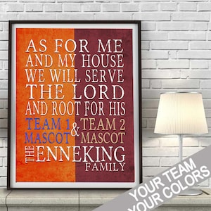 May include: A framed print with a white background and orange and maroon text. The text reads "As for me and my house we will serve the Lord and root for his team 1 & team 2 mascot mascot the Enneking family".