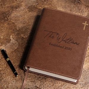 Personalized Bible with custom family name and leatherette cover, designed as a wedding guestbook and meaningful Christian keepsake.