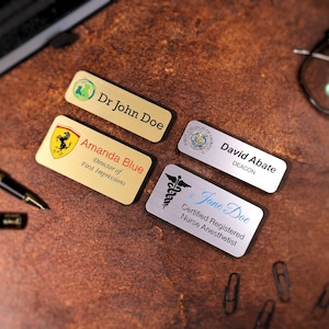 Set of personalized magnetic name badges with full-color UV printing and business logos. Ideal corporate or employee gift, perfect for offices, retail, or events. Durable acrylic custom name tags with secure magnetic backing.