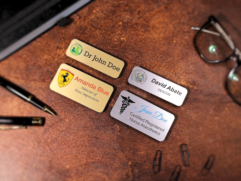 Set of personalized magnetic name badges with full-color UV printing and business logos. Ideal corporate or employee gift, perfect for offices, retail, or events. Durable acrylic custom name tags with secure magnetic backing.