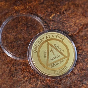 Alcoholics Anonymous recovery coin personalized sobriety medallion engraved milestone chip for 24 hours, 1 year or multiple year anniversary.