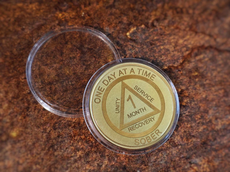 Alcoholics Anonymous recovery coin personalized sobriety medallion engraved milestone chip for 24 hours, 1 year or multiple year anniversary.