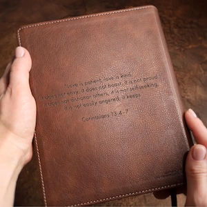 Custom family Bible NIV edition engraved with last name and date, styled as wedding table decor. Personalized leather wedding Bible guest book for Christian wedding, bridal shower gift, religious anniversary gift.