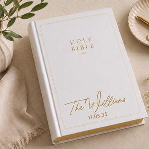 Wedding Bible personalized with your family surname and wedding date on a beautiful white hardcover NIV Family Bible. This custom family Bible creates a lasting family keepsake and heirloom Bible, making a thoughtful Christian wedding gift, anniversary Bible, religious keepsake, personalized Bible, and scripture gift.