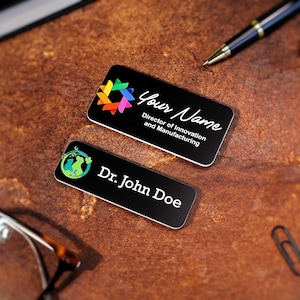 Set of custom UV-printed name badges for office staff and professionals. Acrylic magnetic name tags with colorful logos and clean typography. Personalized company name plates ideal for conferences, front desk teams, and business events.