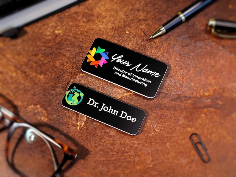 Set of custom UV-printed name badges for office staff and professionals. Acrylic magnetic name tags with colorful logos and clean typography. Personalized company name plates ideal for conferences, front desk teams, and business events.