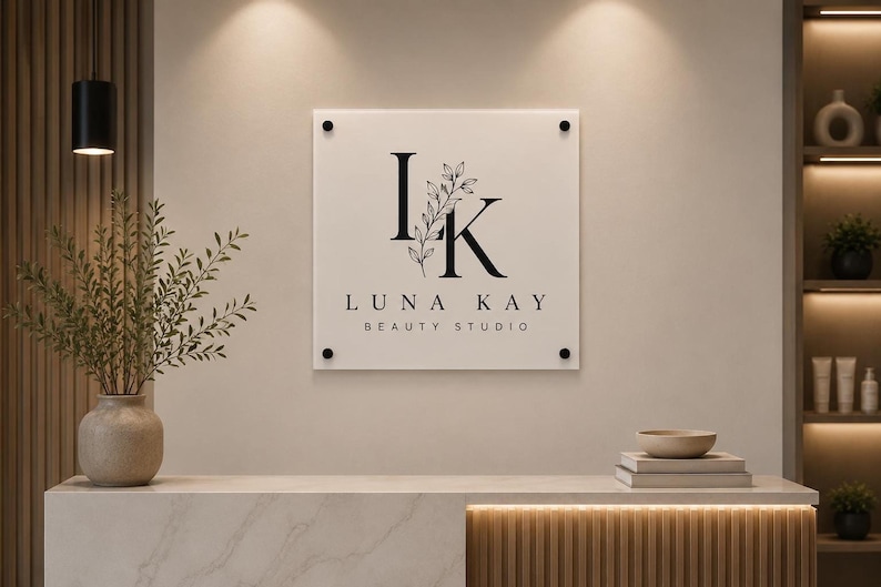 Weather-resistant square acrylic storefront plaque with UV printed company branding and black mounting hardware on an exterior wall.