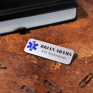 Personalized magnetic office name tags printed in full color with UV technology. Custom acrylic name badges with business logo and employee name. Perfect for professional uniforms, salons, retail stores, and company branding needs.