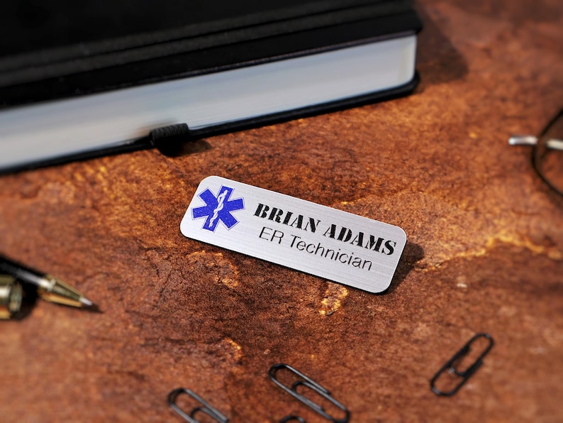 Personalized magnetic office name tags printed in full color with UV technology. Custom acrylic name badges with business logo and employee name. Perfect for professional uniforms, salons, retail stores, and company branding needs.