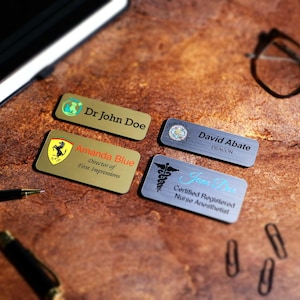 Full-color UV-printed magnetic name badge with personalized text and custom company logo. Professional employee name tag for offices, retail staff, and healthcare teams. Acrylic printed badge with metallic background and glossy finish.