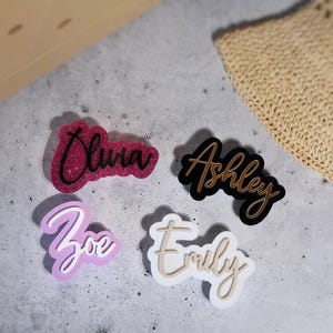 Glitter pink black name tag Bogg Bag Gift Ideas,
Black and gold Bogg Bag ID tag,
Bogg Bag Pastel lavender and white Charms,
Name Plate white and beige Bogg Bag,
Bogg Bag Accesories,
Initial Bogg Bag,
Customize Bogg Bag,
Cute Bogg Bag,
Bogg Bag chain,
Name Tag Bogg Bag,
Personalized Charm,
Crocs Bag Name