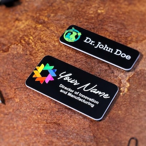 Professional UV-printed magnetic name tag with logo and job title, personalized full-color office badge for corporate teams and staff uniforms. Perfect business gift or conference accessory, printed on metallic silver backing.