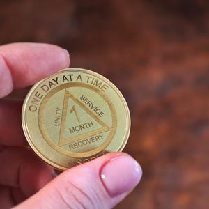 Custom AA sobriety chip laser engraved recovery coin with personalized anniversary year thoughtful sobriety gift for men in recovery.