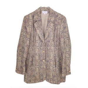 May include: A brown and black snakeskin patterned blazer with gold buttons.