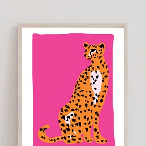 May include: A digital illustration of a cheetah sitting on a bright pink background. The cheetah is orange with black spots and has a white patch on its chest. The text "El Leopardo" is written in black cursive at the bottom of the image.