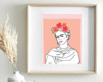 Puede incluir: Impresión de arte de línea de Frida Kahlo con una corona de flores rosas sobre un fondo melocotón. La impresión está enmarcada en un marco de madera claro.