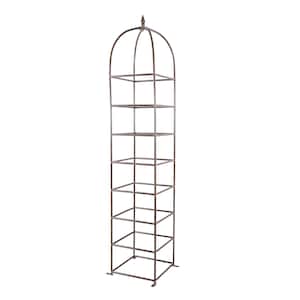 May include: A tall, vertical garden obelisk trellis constructed from dark brown metal. The structure features a square base, multiple horizontal square tiers, and a rounded arched top finished with a pointed finial at the very peak.