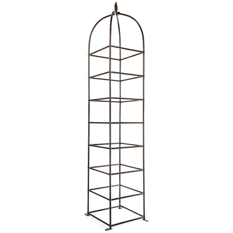 May include: A tall, dark brown metal garden obelisk trellis featuring a square-based frame with multiple horizontal rungs and a rounded, arched top section that culminates in a pointed finial. The structure is designed with a grid pattern.