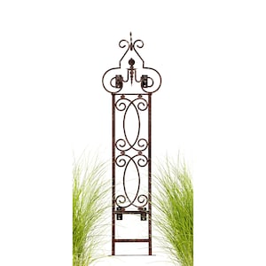 May include: A rusty brown metal garden trellis with a decorative top and a scrolled design. The trellis is standing on a white background.