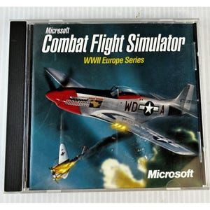 May include: A Microsoft Combat Flight Simulator WWII Europe Series PC game in a clear plastic case. The cover features a silver and red airplane with a white star and the text "Combat Flight Simulator". A second plane is on fire.