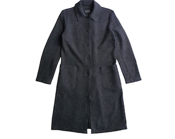 May include: A dark gray long-sleeved coat with a button-up front and two pockets. The coat has a collar and is made of a textured fabric.