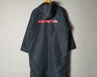 May include: Black hooded jacket with a long length and a red "HONDA" logo on the back.