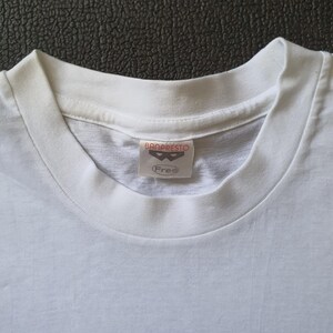 May include: White t-shirt with a Banpresto label featuring a black mask logo and the word "Free".