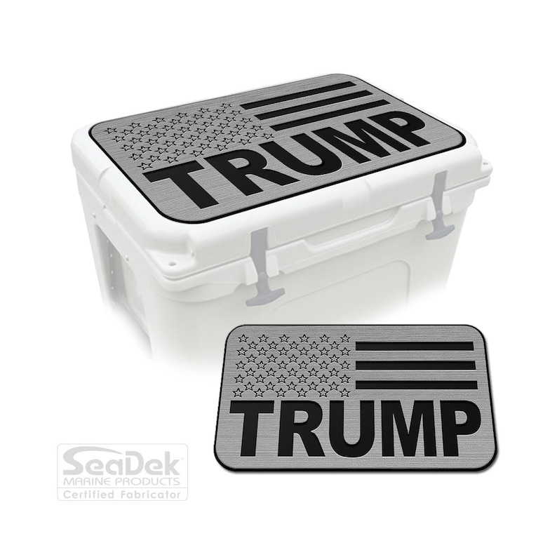 May include: A white cooler with a gray lid featuring a design of the American flag and the name "TRUMP" in bold black letters. A smaller version of the lid design is also shown.