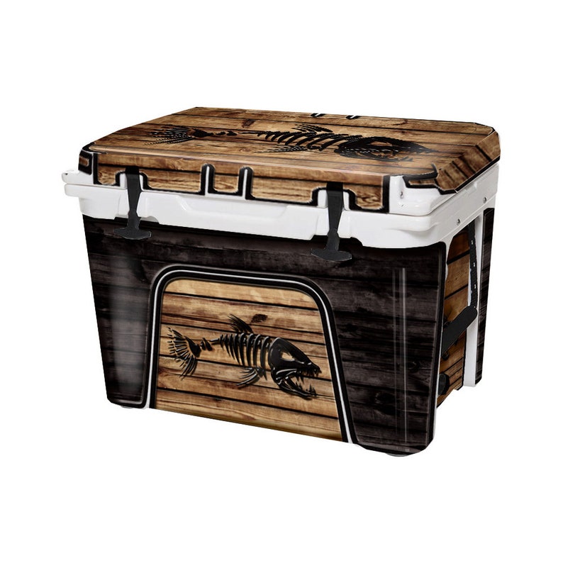 May include: A white cooler with a wood-grain and fish skeleton design. The cooler has a black handle and a black latch.