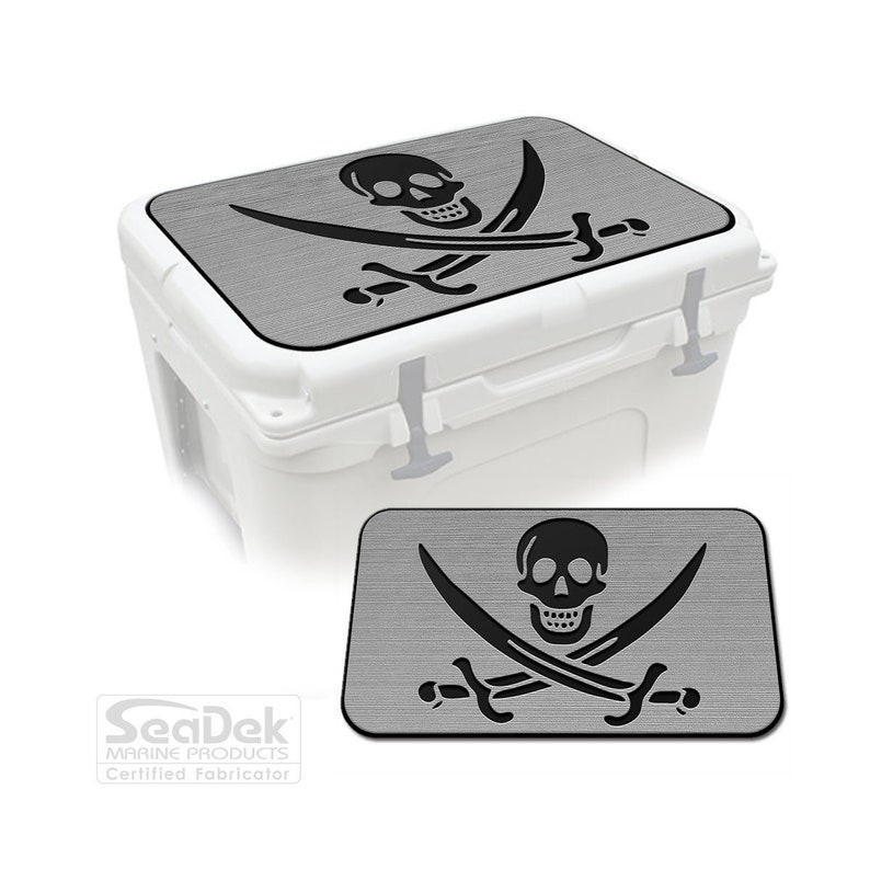 May include: Gray cooler lid with a black skull and crossbones design. The lid is made by SeaDek Marine Products, a certified fabricator.