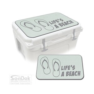 May include: A light green cooler lid with a gray graphic of flip flops and the text "Life's a Beach".