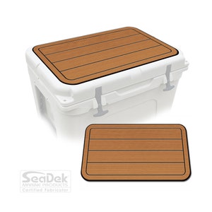 May include: A brown teak-look SeaDek non-slip pad for a cooler lid. The pad has a black border and four raised lines to mimic wood grain.