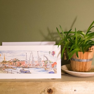 Bristol Greetings Card- Bristol Harbourside- Kranen, M-Shed, Ballonnen, Ferry, Comorant, St Mary Redcliff Church. Kaart leeg binnenin