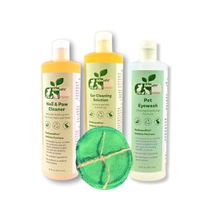May include: Three bottles of pet care products with green labels and a green cotton pad. The bottles are labeled "Nail & Paw Cleaner", "Ear Cleaning Solution", and "Pet Eyewash".