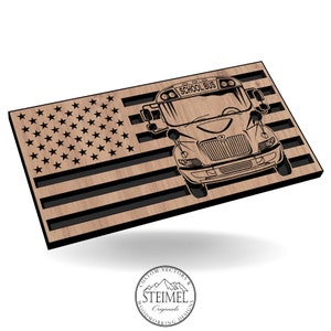 May include: A wooden American flag with a black and white illustration of a school bus in the center. The bus has the words "School Bus" on the front.