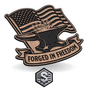 May include: A wooden emblem featuring an American flag, an anvil, and the text "FORGED IN FREEDOM." The flag is detailed with stars and stripes. The anvil is black, and the banner is light brown. A smaller emblem with the letter "S" is at the bottom.