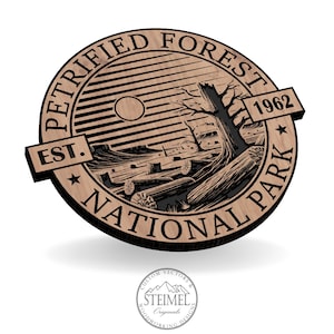 May include: A wooden sign with the text "Petrified Forest National Park Est. 1962" in a black circle with a stylized image of a forest scene.